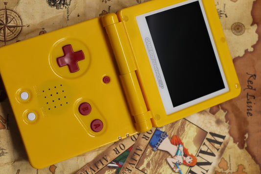 Game Boy Advance SP Custom One Piece Shell Nintendo handheld console with custom One Piece themed shell clamshell design backlit screen rechargeable battery cartridge based portable retro gaming system front