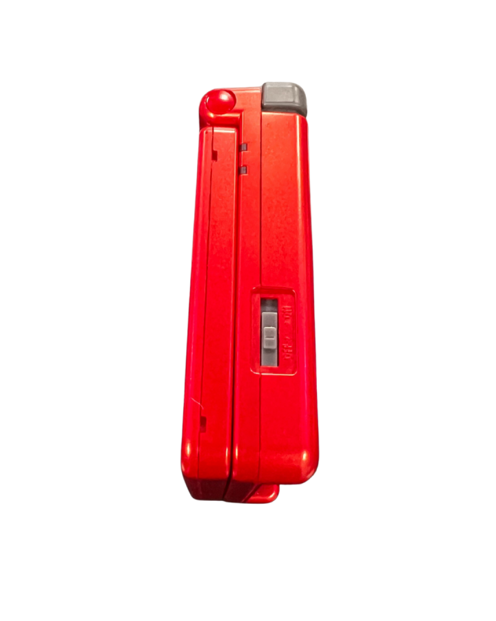 Side view of the official Game Boy Advance SP Groudon Edition console closed, showing the red metallic casing and power switch.