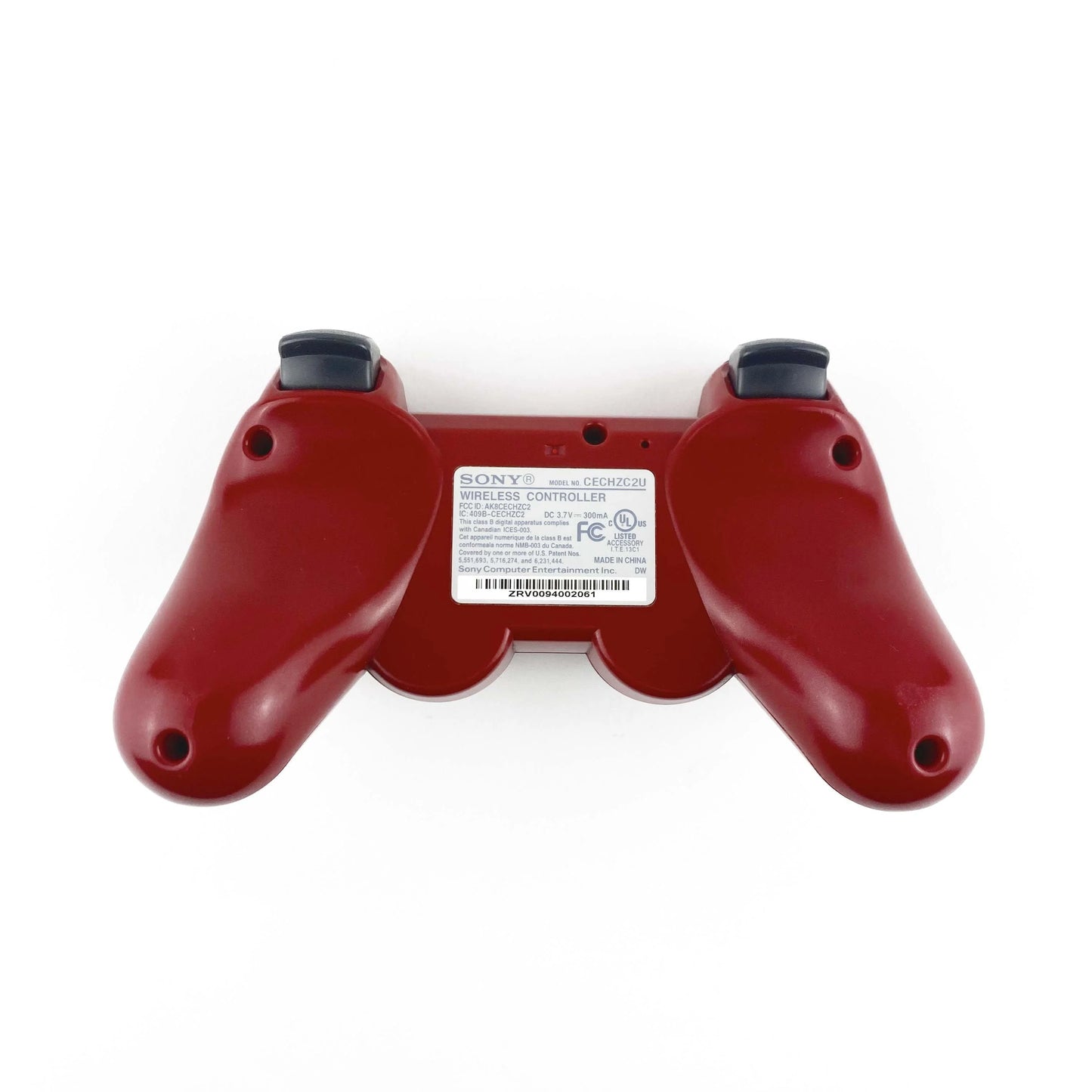 DualShock 3 wireless controller in red featuring classic PlayStation button layout and responsive analog controls
