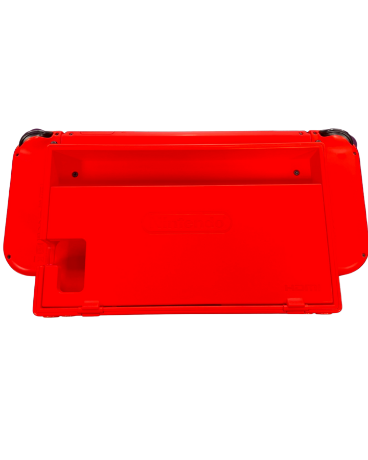 Back view of the red Mario Edition Nintendo Switch console placed in its matching red dock, showing the rear casing and dock cutouts for cables.