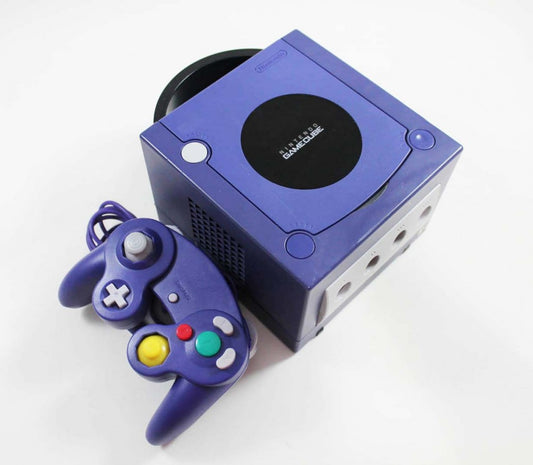 Indigo Nintendo GameCube top view with circular disc cover and matching third-party controller.