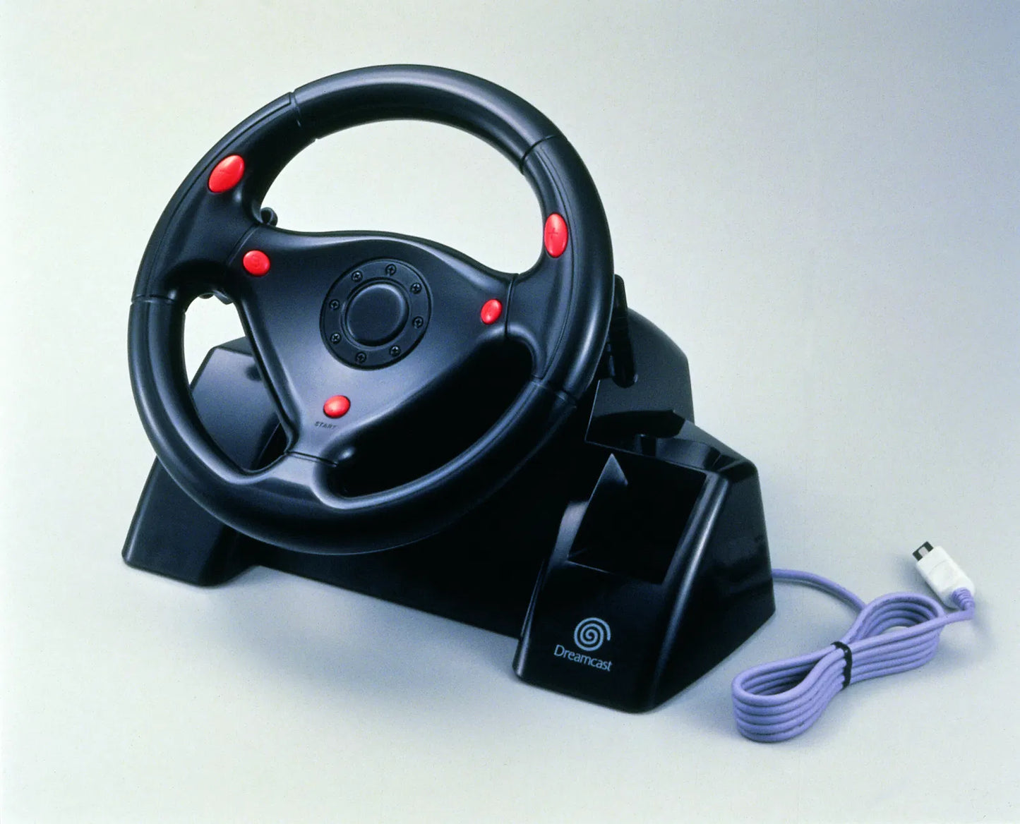 Sega Dreamcast Official Rally Wheel Controller for racing games featuring authentic arcade-style steering and pedal controls