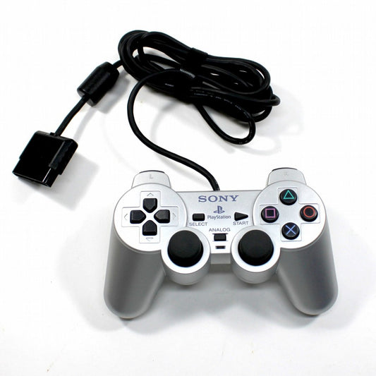 Silver PlayStation 2 DualShock 2 controller featuring analog precision, vibration feedback, and sleek metallic finish top view