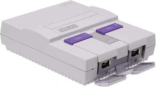 Front view of the Super Nintendo Entertainment System (SNES) Mini console showing its gray casing, purple buttons, and exposed controller ports.
