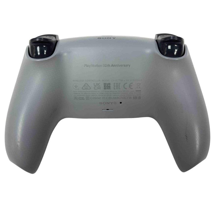 PlayStation 5 DualSense Wireless Controller 30th Anniversary Edition Pre Owned PS5 gaming accessory featuring classic PlayStation gray design retro inspired colored logo and iconic button symbols wireless Bluetooth connectivity adaptive triggers haptic feedback immersive vibration built in microphone touchpad motion sensors ergonomic grip rechargeable battery and responsive PlayStation 5 gaming controls collectible anniversary edition controller and gaming setup appeal back