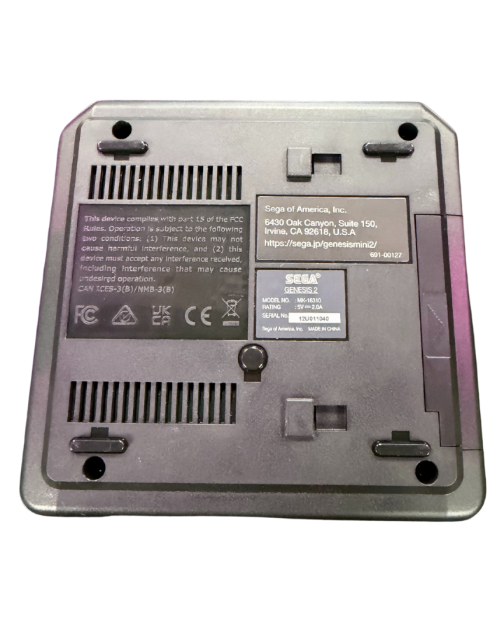 Bottom view of a Sega Genesis Mini 2 console showing screw placements, ventilation grilles, and label details.