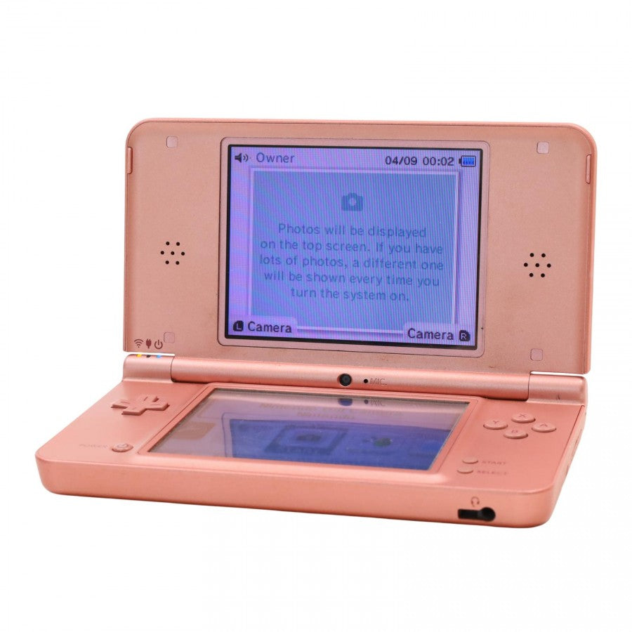 Opened Nintendo DSi XL in rose pink powered on, displaying dual screens with home menu and control buttons visible