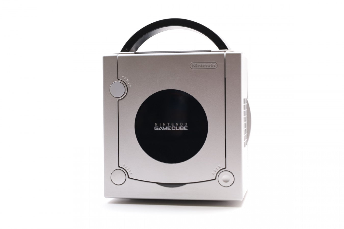 Platinum Nintendo GameCube top view showing circular disc cover and cube-shaped design.