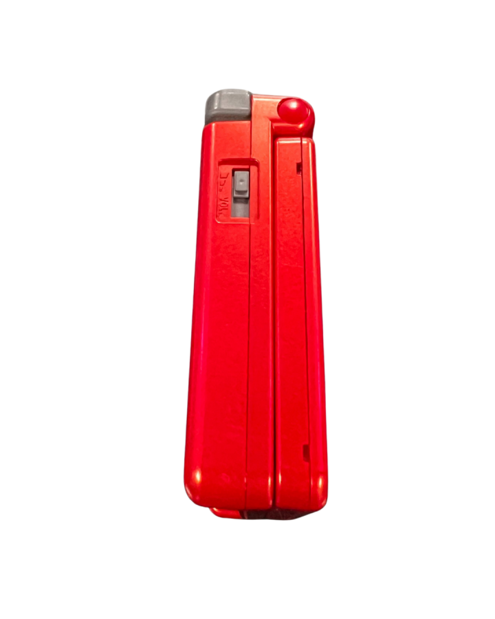 Side view of the official Game Boy Advance SP Groudon Edition console closed, showing the red metallic casing and volume slider.