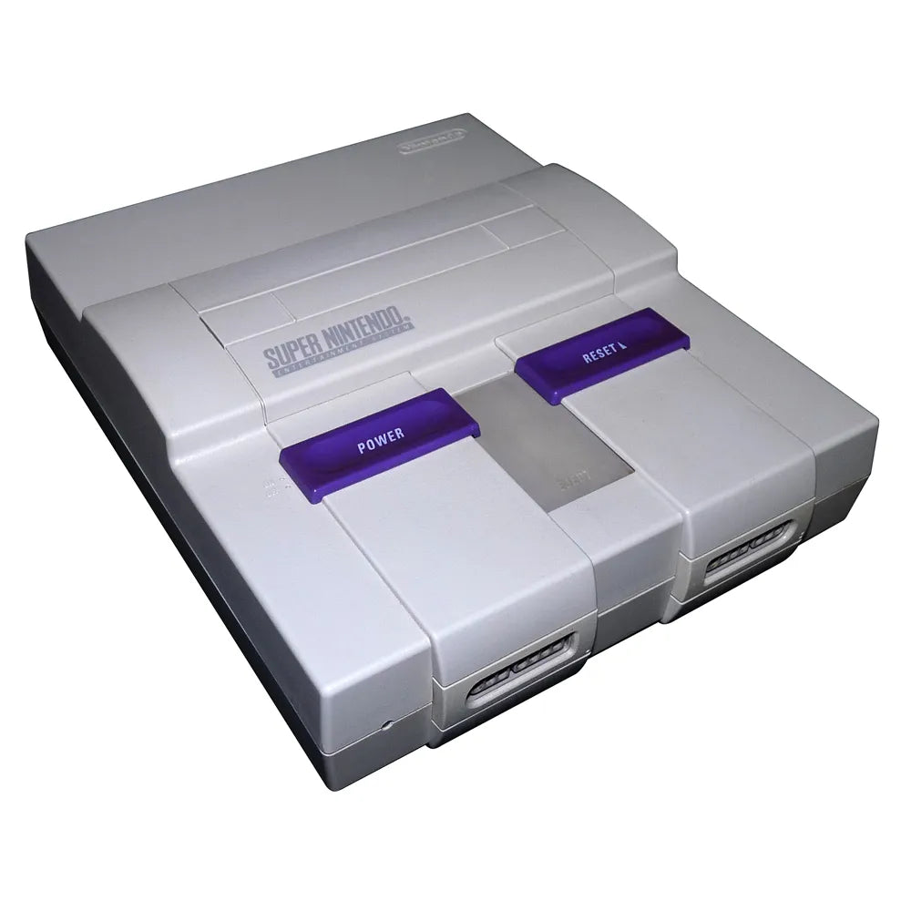 Front view of the original Super Nintendo Entertainment System (SNES) console with gray casing, purple power and reset switches, cartridge slot, and two controller ports.