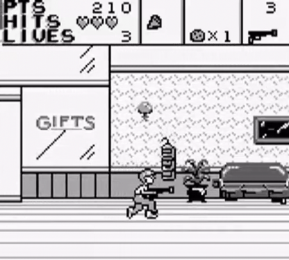 Home Alone 2 Lost in New York for Game Boy, gameplay for an action platformer video game with side-scrolling gameplay, trap-setting mechanics, enemy avoidance, and movie-inspired challenges