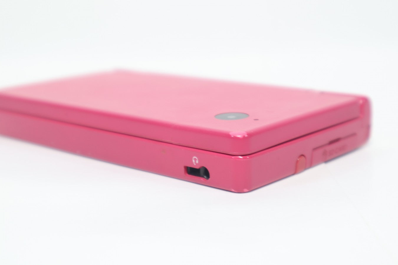 Nintendo DSi Pink Nintendo DSi handheld console in pink color dual screen portable gaming system built in cameras touch screen WiFi capable retro handheld device closed