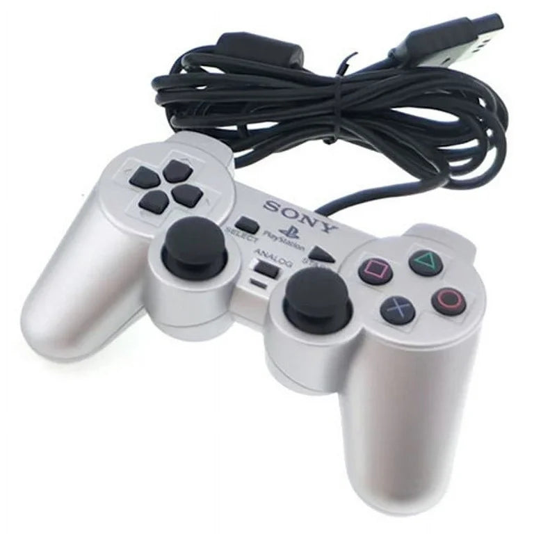 Silver PlayStation 2 DualShock 2 controller featuring analog precision, vibration feedback, and sleek metallic finish