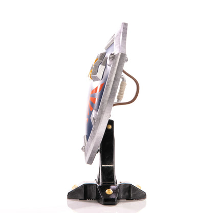Hylian Shield 12 inch statue by First 4 Figures detailed Legend of Zelda collectible featuring iconic Hylian crest battle ready shield design and premium high quality display piece for fans of Nintendo fantasy adventure franchise side view
