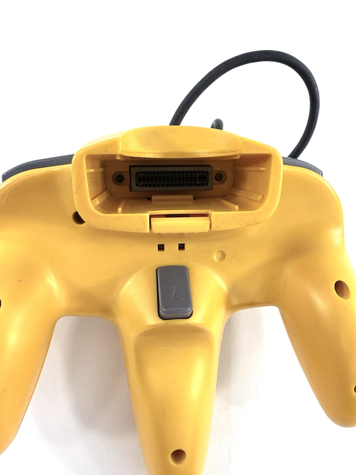 Nintendo 64 Controller Yellow OEM original first party controller for the Nintendo 64 featuring a bright yellow design with analog stick ergonomic three prong grip and responsive buttons for classic multiplayer gaming back 
