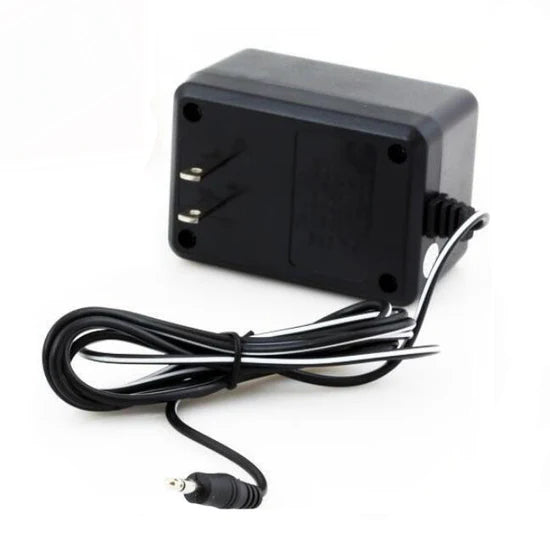 Atari 2600 power adapter close up with wall plug and cable for retro gaming console