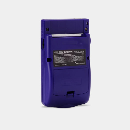 Back view of a grape purple Nintendo Game Boy Color handheld console showing battery cover and cartridge slot.