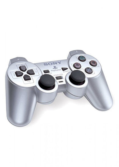 Silver PlayStation 2 DualShock 2 controller featuring analog precision, vibration feedback, and sleek metallic finish top angled view