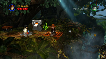 LEGO Indiana Jones The Original Adventures Platinum Family Hits Xbox 360 video game featuring action adventure gameplay based on Indiana Jones classic movie scenes LEGO characters exploration puzzle solving combat challenges collectible treasures and cooperative gameplay Xbox 360 retro video game collection collectible gaming appeal gameplay