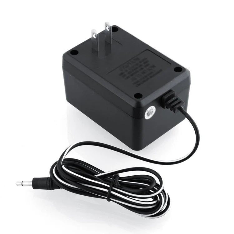 Atari 2600 AC power adapter angled view with cable and connector replacement accessory
