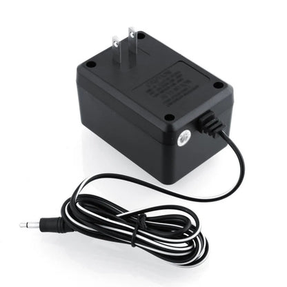 Atari 2600 AC power adapter angled view with cable and connector replacement accessory