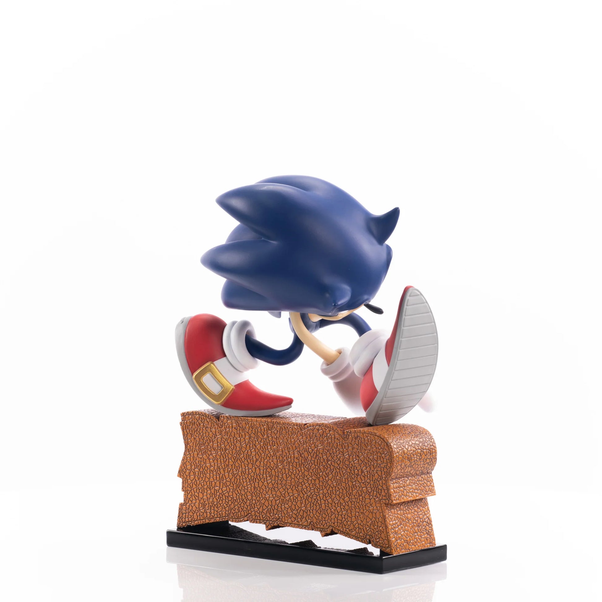 Sonic the Hedgehog First 4 Figures 9 inch statue featuring a dynamic running pose with detailed sculpt vibrant blue coloring themed display base inspired by the Sonic Adventure series and high quality collectible design for display
