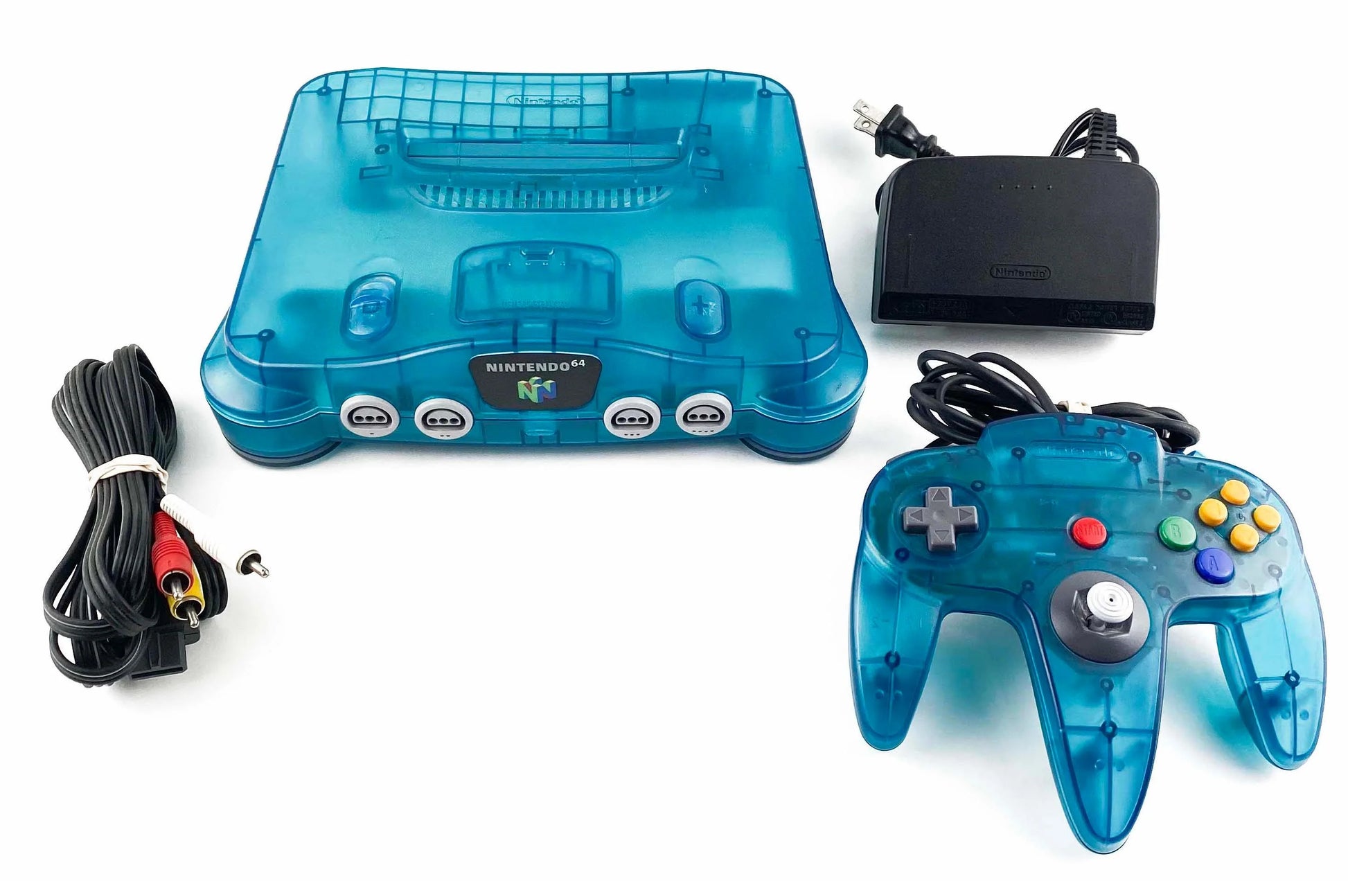 Nintendo 64 Console System (N64) Funtastic Ice Blue with Official Funtastic Ice Blue Controller – Yellowed Condition at Gamers INC, featuring the iconic 64-bit powerhouse in its vibrant, translucent Ice Blue finish from the classic Funtastic series; despite its age-related yellowing, this bundle includes the matching official controller and delivers the authentic multiplayer magic of the N64 library, from Super Mario 64 to GoldenEye 007, in a collectible, retro-styled package console bundle and cords