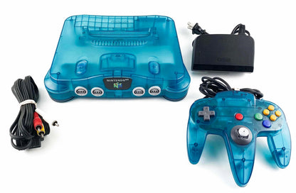 Nintendo 64 Console System (N64) Funtastic Ice Blue with Official Funtastic Ice Blue Controller – Yellowed Condition at Gamers INC, featuring the iconic 64-bit powerhouse in its vibrant, translucent Ice Blue finish from the classic Funtastic series; despite its age-related yellowing, this bundle includes the matching official controller and delivers the authentic multiplayer magic of the N64 library, from Super Mario 64 to GoldenEye 007, in a collectible, retro-styled package console bundle and cords
