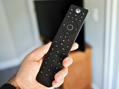 Xbox Series X and Xbox One media remote long edition accessory XONE held in hand