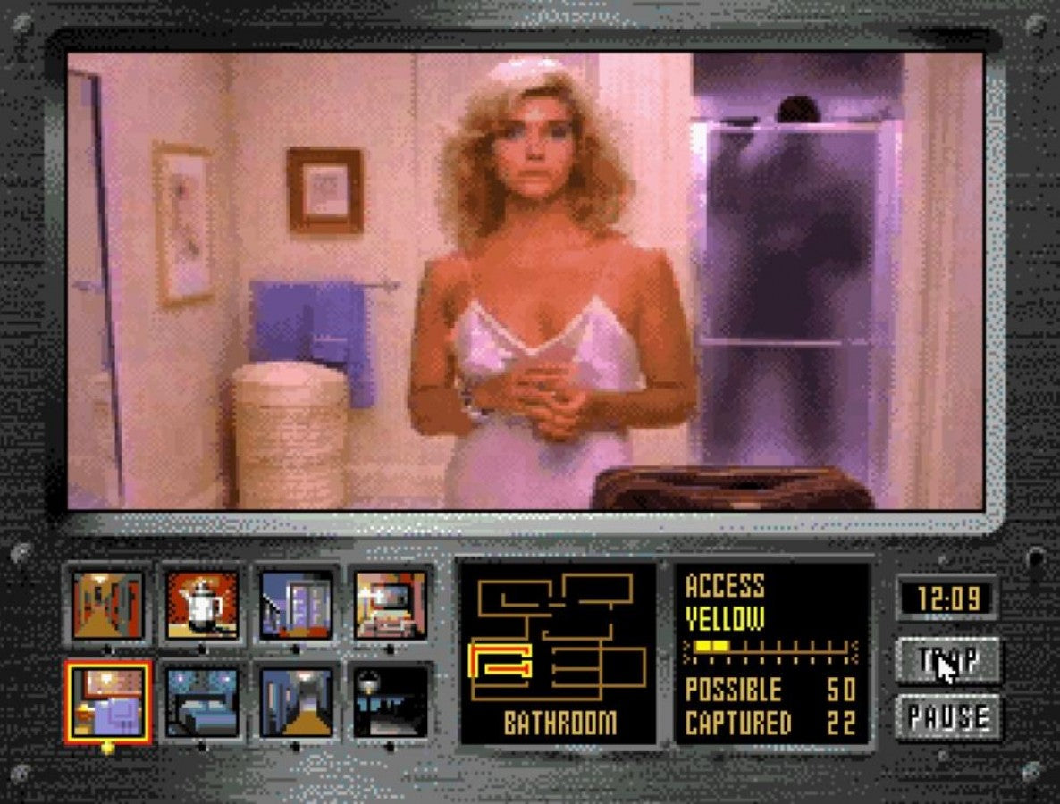 Night Trap Sega CD 32X (enhanced Sega CD version) full motion video FMV interactive movie game surveillance horror traps gameplay live action footage mansion setting vampire attack storyline branching choices Digital Pictures retro gaming Sega CD software video game title gameplay