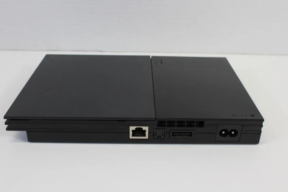 Retro PS2 Slim SCPH 90000 inspired design featuring sleek PlayStation 2 hardware aesthetic compact black console design iconic Sony gaming system integrated power supply streamlined form factor sixth generation gaming nostalgia presentation top rear