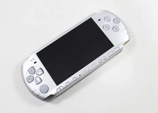 Silver PlayStation Portable PSP 3000 handheld gaming system featuring enhanced widescreen display built in microphone UMD game support Wi Fi connectivity multimedia playback slim portable design rechargeable battery iconic Sony handheld console compatibility with PSP games collectible gaming appeal