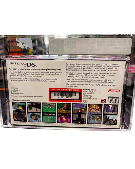 Back view of a sealed, VGA-graded Nintendo DS system encased in a clear acrylic display box with grading label visible on top.