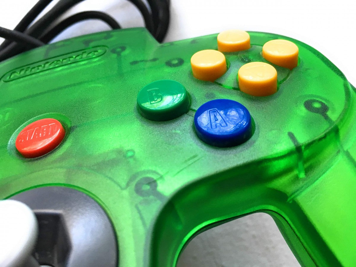Nintendo 64 Controller Jungle Green official Nintendo OEM N64 controller in jungle green translucent color featuring analog stick three prong design and rumble pack compatible accessory close 