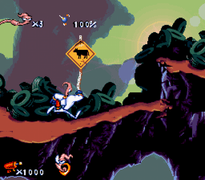 Earthworm Jim cartridge for the Super Nintendo Entertainment System featuring 16 bit side scrolling platformer action with quirky humor weapon based combat and vibrant cartoon style levels as Earthworm Jim battles enemies to save the galaxy gameplay 
