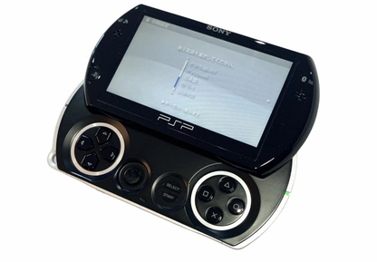 PSP Go Piano Black PlayStation Portable PSP for portable gaming fans featuring compact sliding design Piano Black finish built in controls digital game support 3.8 inch display Bluetooth wireless connectivity internal storage and sleek portable Sony gaming hardware collectible appeal front