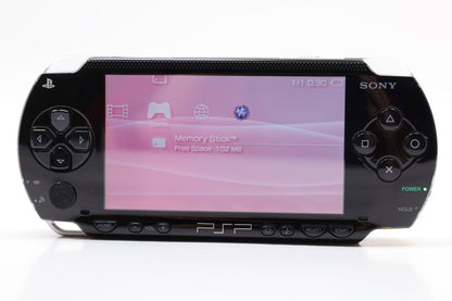 PlayStation Portable 2000 PSP 2000 Black JPN Japan Import Region Free handheld gaming console featuring a sleek black design portable gaming system UMD game support memory card compatibility vibrant widescreen display built-in controls Japanese import hardware region free gameplay and scratch and scuff condition collectible gaming appeal 