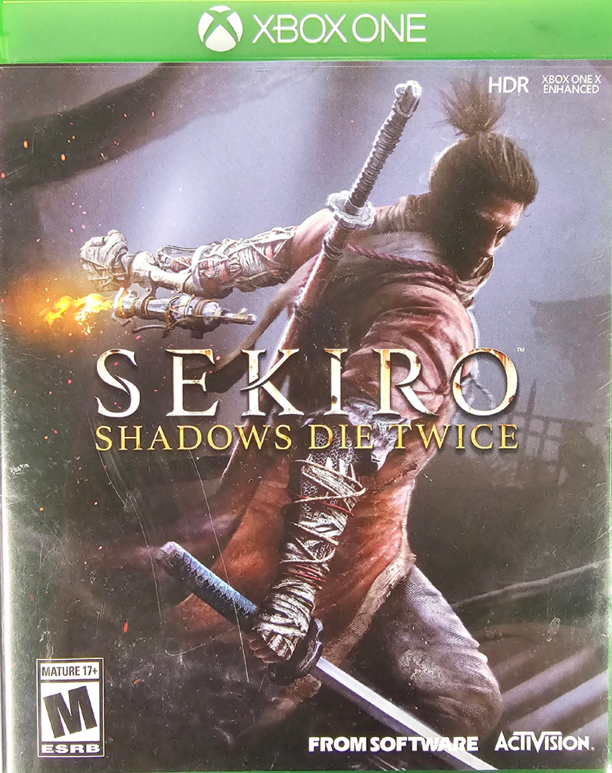 Sekiro Shadows Die Twice Xbox One XONE for action adventure video game fans featuring shinobi combat samurai warriors sword fighting stealth gameplay parrying prosthetic arm abilities challenging enemies intense boss battles Japanese environments and difficult skill based gameplay collectible gaming appeal front cover art