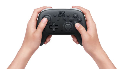 Nintendo Switch 2 Pro Controller Nintendo Switch 2 NS2 official wireless gaming controller featuring ergonomic design precision analog sticks responsive buttons HD rumble motion controls wireless connectivity rechargeable battery and enhanced Nintendo Switch 2 gameplay compatibility premium Nintendo gaming accessory collectible controller hardware appeal front in hands