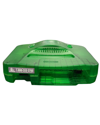 Nintendo 64 Jungle Green console featuring the translucent green clamshell design standard N64 hardware with cartridge slot, four controller ports, and compatible with classic N64 games