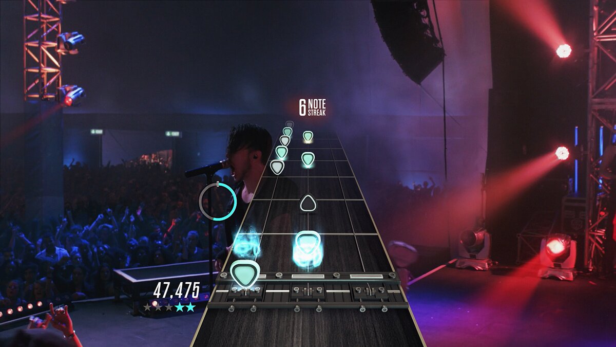 Guitar Hero Live Xbox 360 rhythm music video game franchise reboot redesigned 6-button guitar controller GH Live first-person FMV concert crowds reactive audience GHTV playable music video network streaming song library competitive leaderboards gameplay screenshot