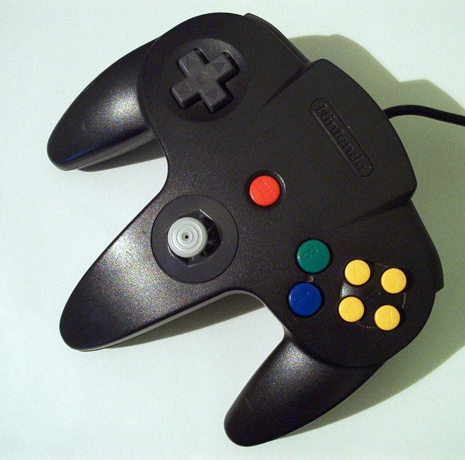 Top view of the black Nintendo 64 controller, showing joystick, D-pad, action buttons, and ergonomic design for comfortable gameplay