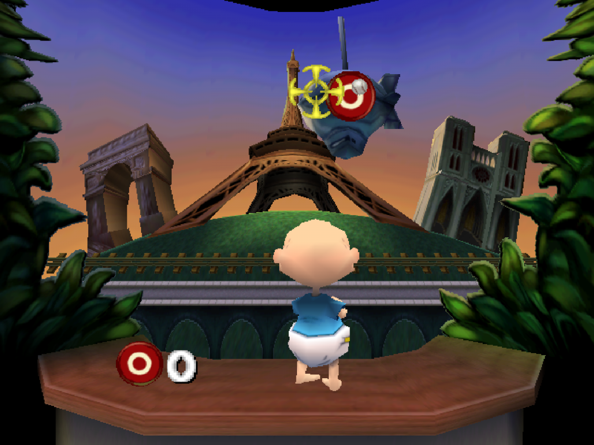Rugrats in Paris The Movie cartridge for the Nintendo 64 featuring 3D platforming adventure gameplay with mini games as Tommy Chuckie and friends explore a colorful Paris theme park based on the animated movie gameplay 