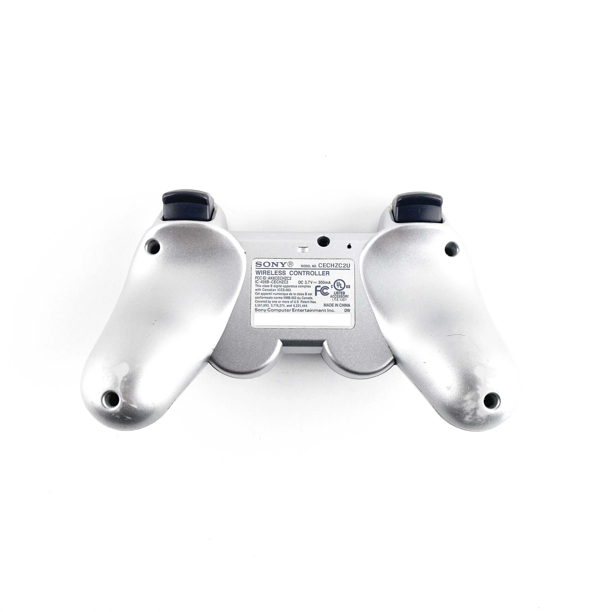 PlayStation 3 PS3 DualShock 3 Controller OEM Silver original Sony wireless game controller featuring pressure-sensitive buttons analog sticks vibration feedback Sixaxis motion sensing USB charging rechargeable battery silver finish and classic PlayStation 3 PS3 gaming accessory collectible appeal bottom