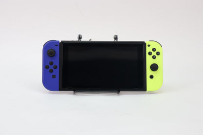 Nintendo Switch system with dock and blue and yellow Joy Cons featuring versatile home and portable gaming modes front view
