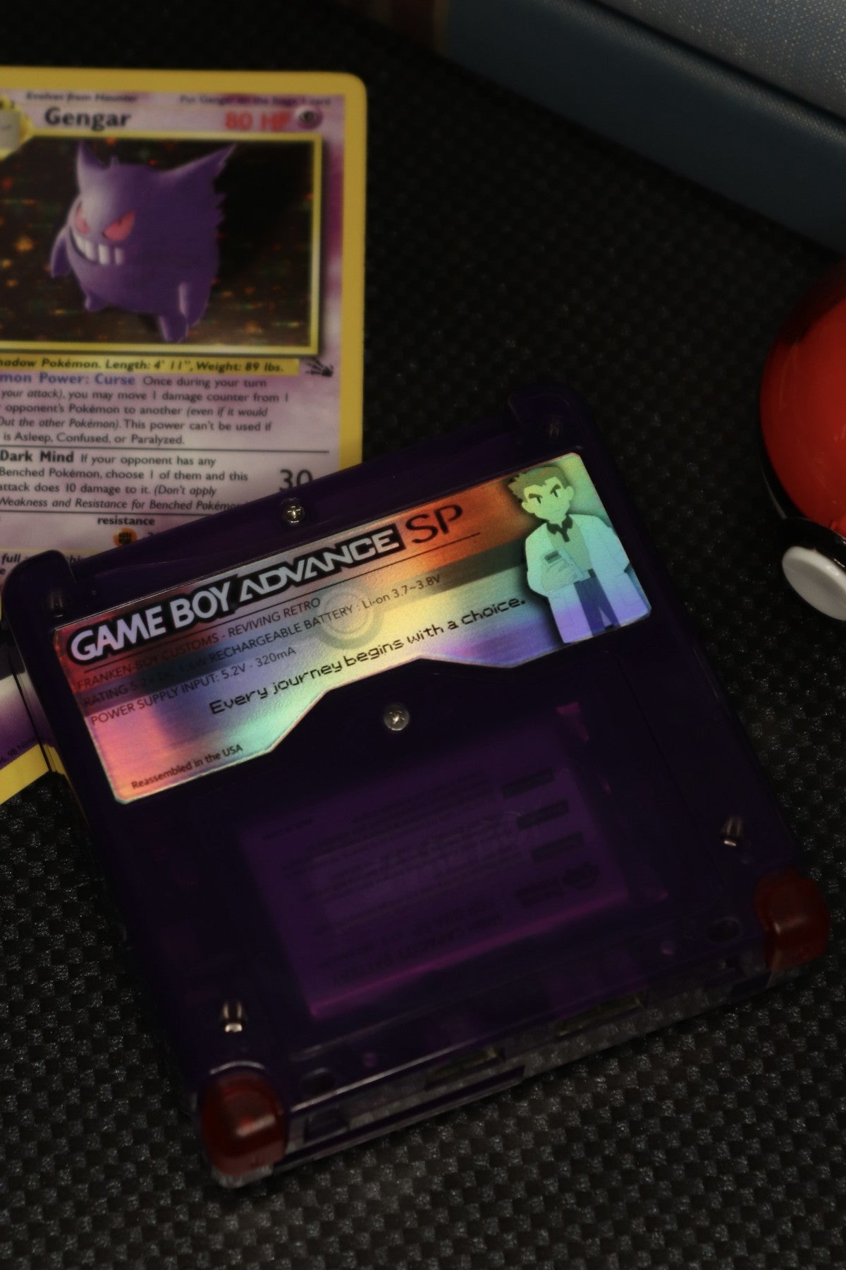 Game Boy Advance SP Custom Gengar Shell Nintendo handheld console with custom Gengar themed shell clamshell design backlit screen rechargeable battery cartridge based portable retro gaming system