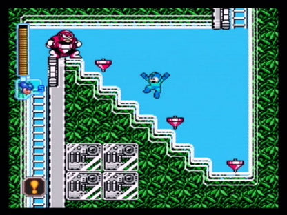 Mega Man Anniversary Collection PlayStation 2 (PS2) gameplay showing classic characters and bold retro graphics.