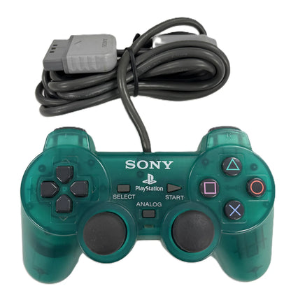 Emerald green PS1 DualShock controller with translucent casing and classic PlayStation buttons and analog sticks