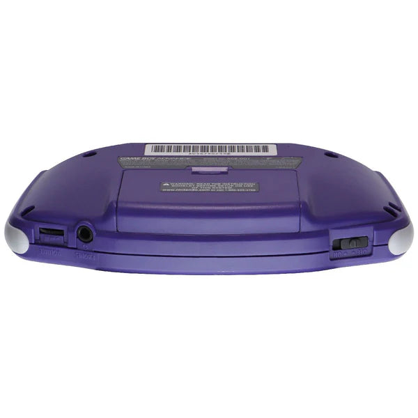 Bottom-up view of the back of an indigo Game Boy Advance console showing its battery cover, shoulder buttons, and cartridge slot.
