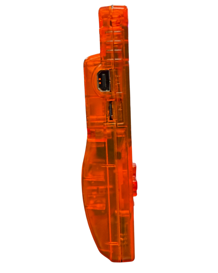 Side view of a clear orange custom Nintendo Game Boy Color handheld console showing the volume dial and transparent casing.
